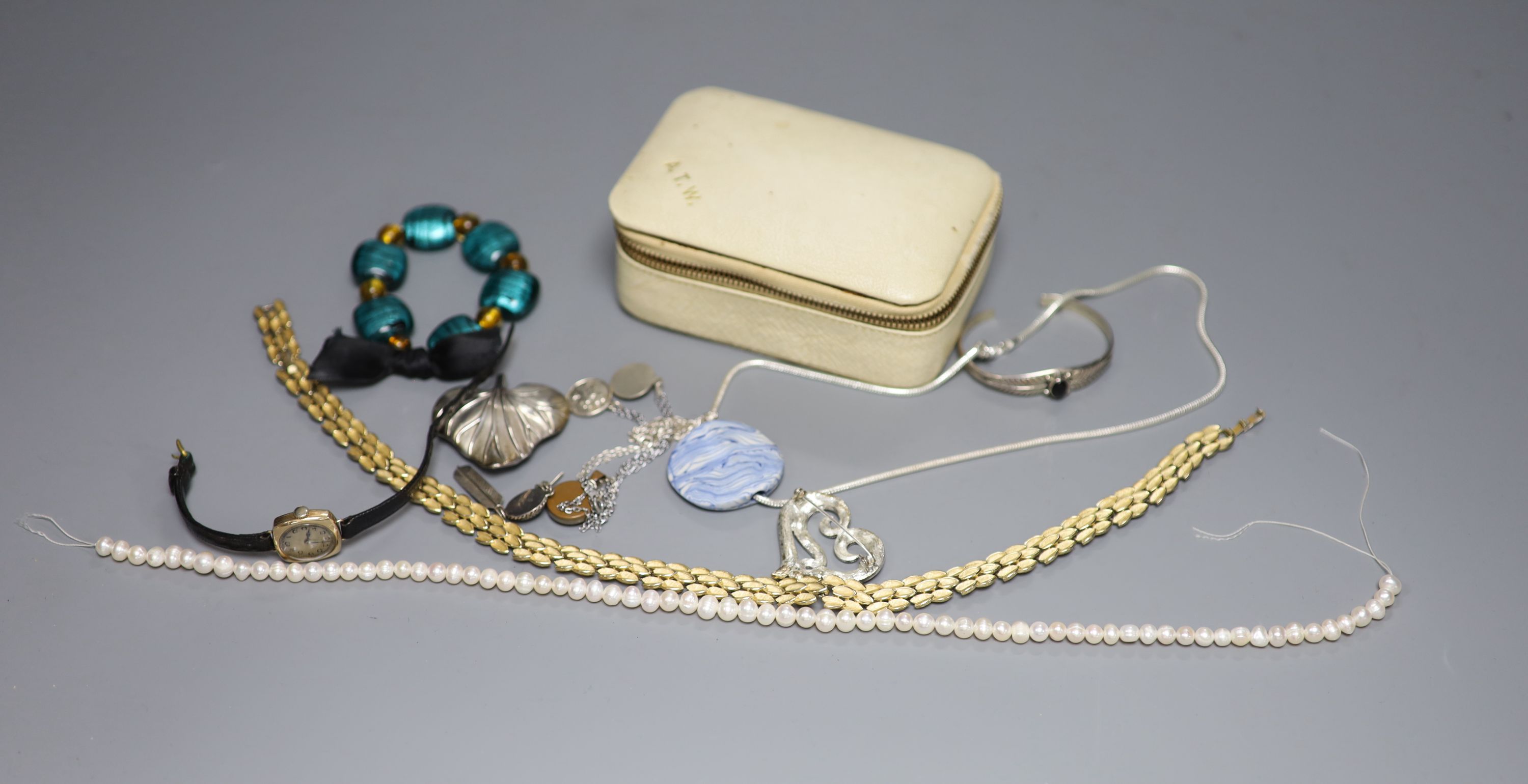 A ladys 9ct gold manual wind wrist watch and a small quantity of jewellery including white metal and costume.